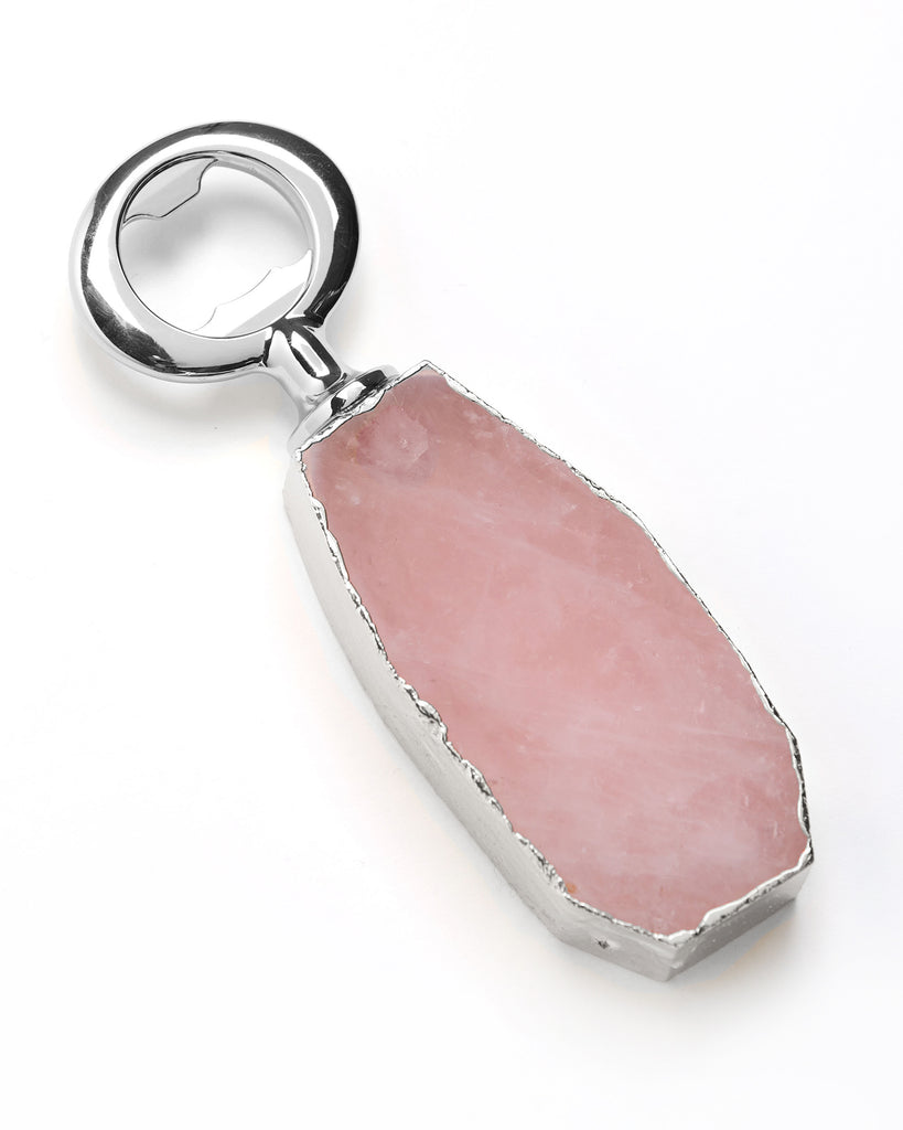 Our natural crystal bottle openers are a lovely accessory to add to your bar stool when you're entertaining or for your nights in to add some extra elegance. With natural Rose Quartz, coated in silver plating, this bottle opener will add style and luxury to any event   Rose Quartz Crystal  11-13cm  Silver Plating  Please note: Due to our crystals being 100% natural, shape and colour patterns will vary.