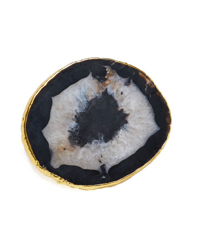 Gold plated black agate crystal coasters. Our natural crystal coasters are the perfect addition to your dining room or coffee table. With natural black agate from Brazil, coated in yellow gold plating, this coaster is an easy way to elevate the luxury in your home.   Black Agate Crystal   80-120 mm   Yellow Gold Plating  Please note: Due to our crystals being 100% natural, shape and colour patterns will vary. 