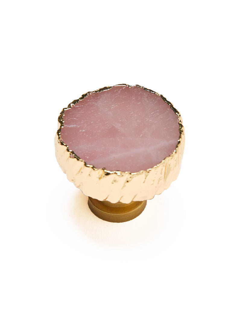 Gold plated rose quartz crystal cabinet handle. Our natural crystal cabinet pulls will add a unique style to your interior decor, from wardrobes to cabinets. Displaying a natural Rose Quartz, a crystal symbolising self love, coated in yellow gold plating. Adding the finishing touches to your elegant home.
